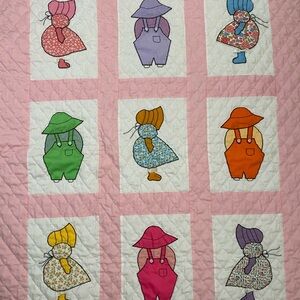 Colorful Patchwork Quilt with Sunbonnet Sue Design